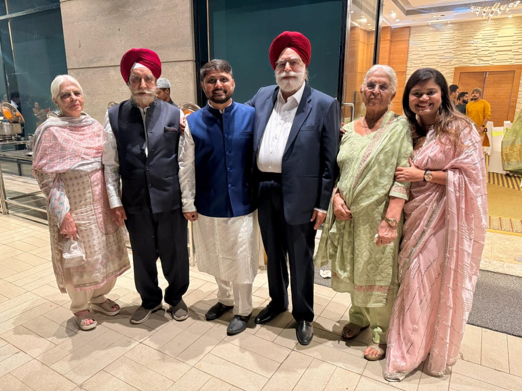 Therapist educating patients about spinal health at the camp