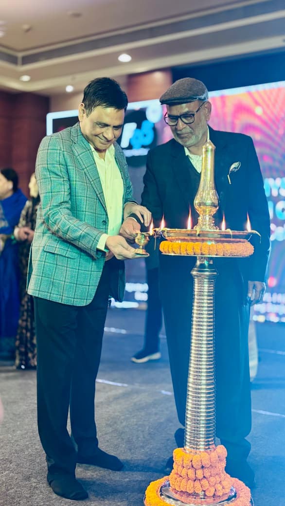 Physiotherapist performing ergonomic assessment for factory worker