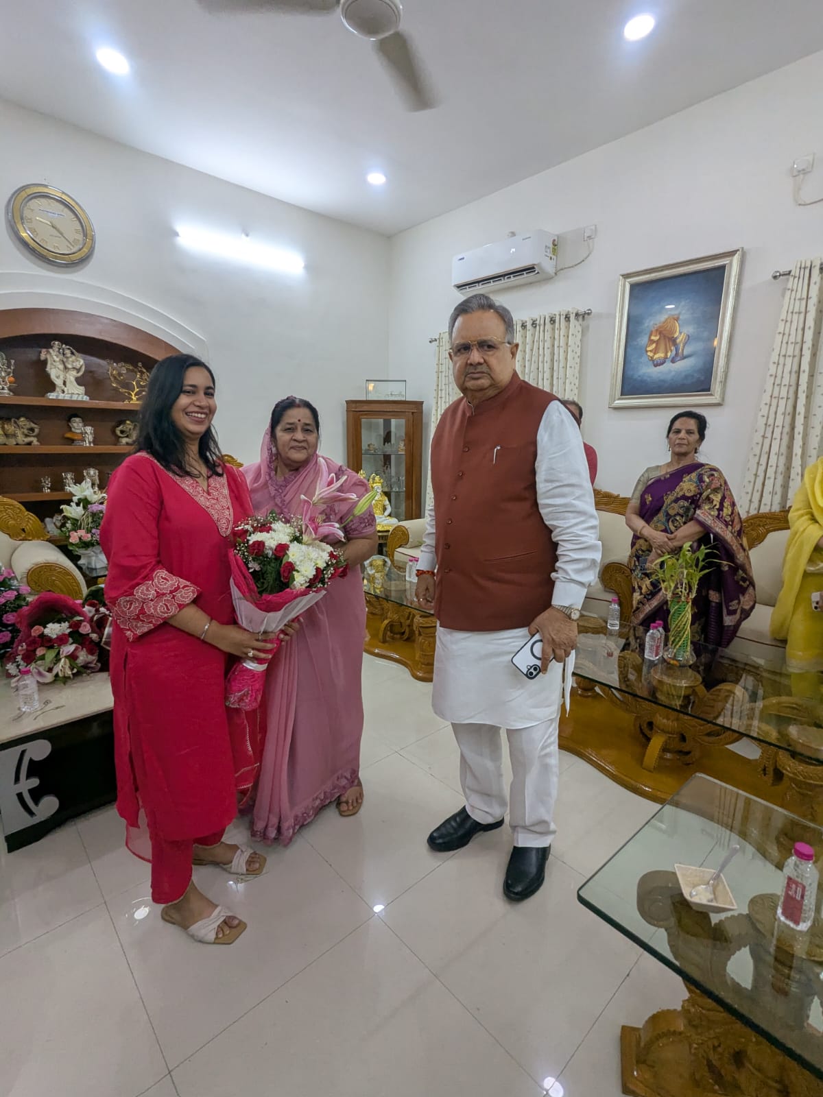 Physiotherapist performing ergonomic assessment for factory worker