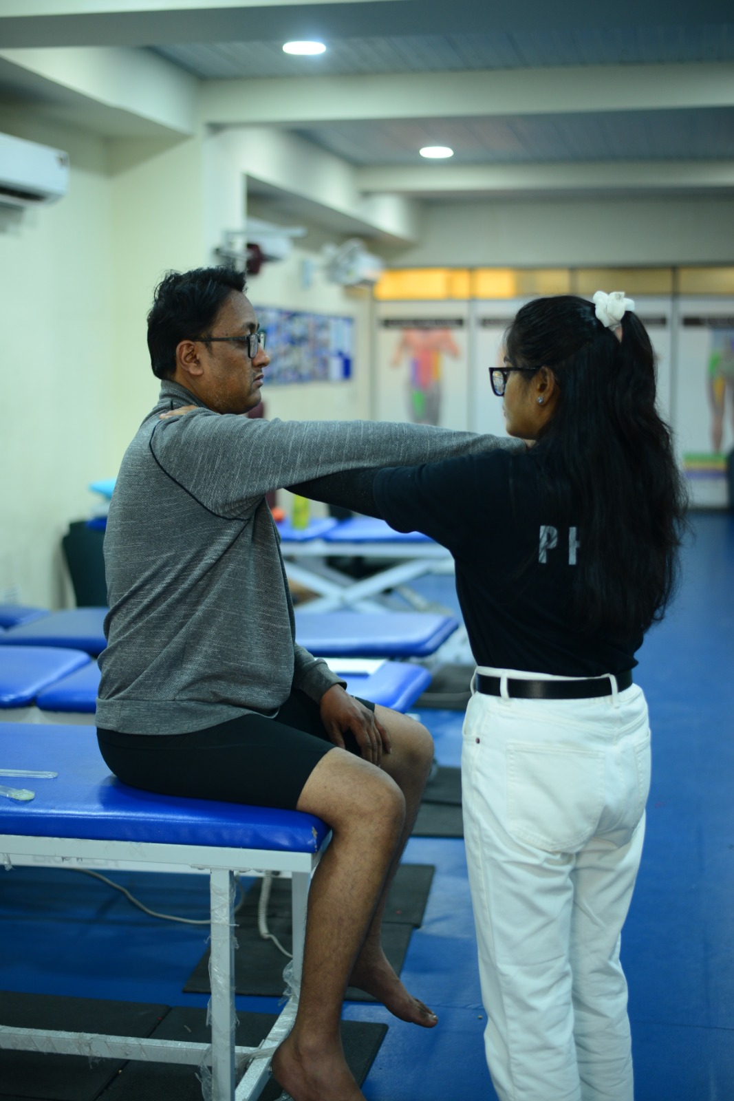 F95 therapist giving health awards and certificates to school students